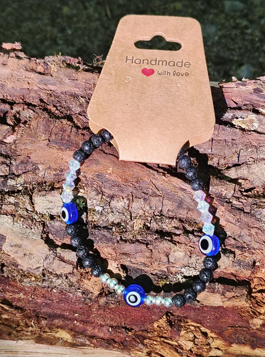 Eyes of Strength bracelet on log display